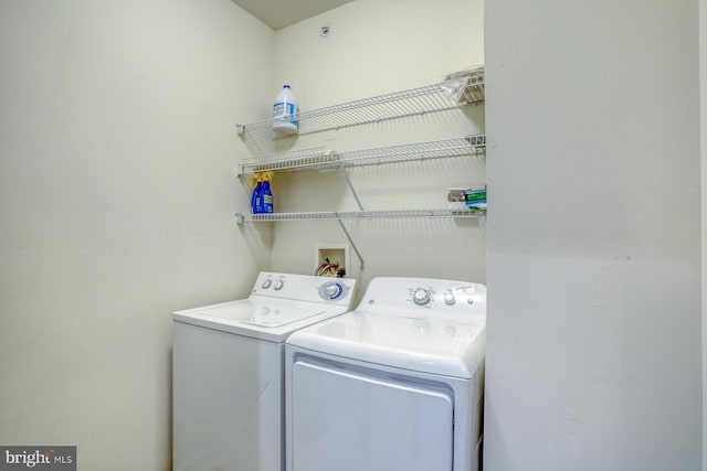 washroom with laundry area and washing machine and dryer