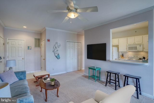 living room with crown molding, baseboards, ceiling fan, and visible vents