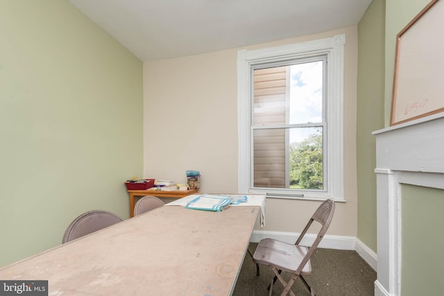 office area featuring baseboards, plenty of natural light, and carpet
