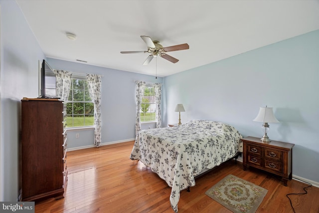 144 Trellis Ln, Sewell, NJ 08080 - bedroom with wood finished floors, baseboards, and ceiling fan