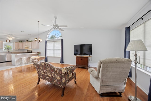 144 Trellis Ln, Sewell, NJ 08080 - living room featuring a ceiling fan, lofted ceiling, light wood-style floors, a chandelier, and baseboards