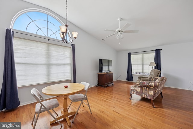144 Trellis Ln, Sewell, NJ 08080 - dining area with vaulted ceiling, light wood-style floors, a ceiling fan, and a chandelier