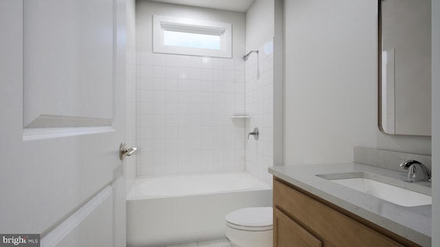 bathroom with vanity, tub / shower combination, and toilet