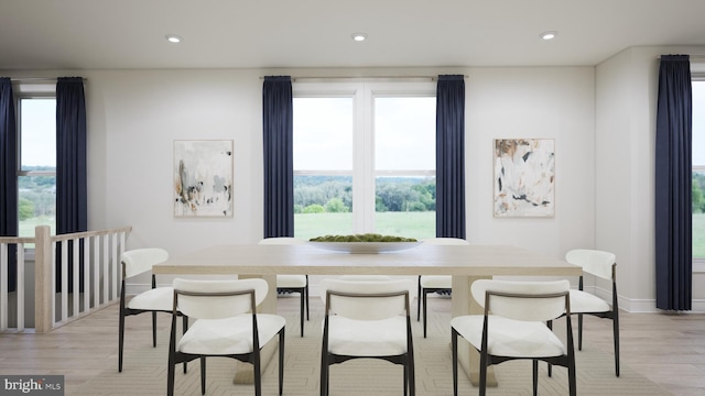dining room featuring recessed lighting, light wood finished floors, and baseboards