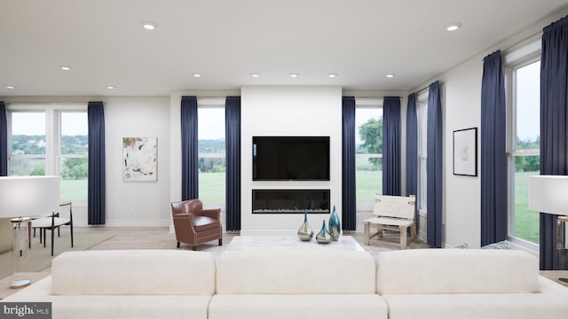 living room with baseboards and recessed lighting