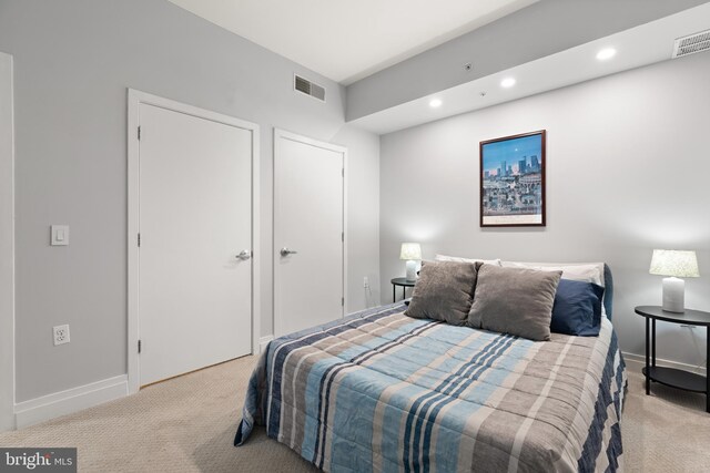 bedroom featuring carpet floors, recessed lighting, and visible vents