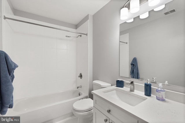 bathroom with bathing tub / shower combination, vanity, toilet, and visible vents