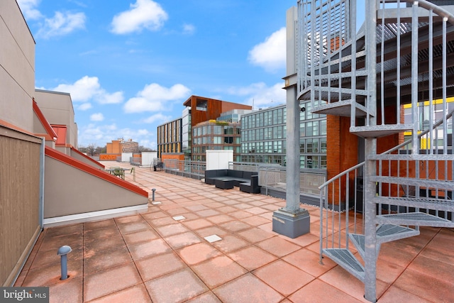view of patio / terrace featuring a city view