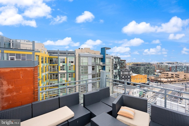 balcony with a city view and an outdoor hangout area
