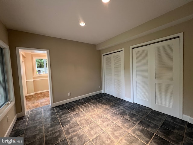 8122 Stacey Rd, Alexandria, VA 22308 - unfurnished bedroom with two closets, baseboards, and recessed lighting