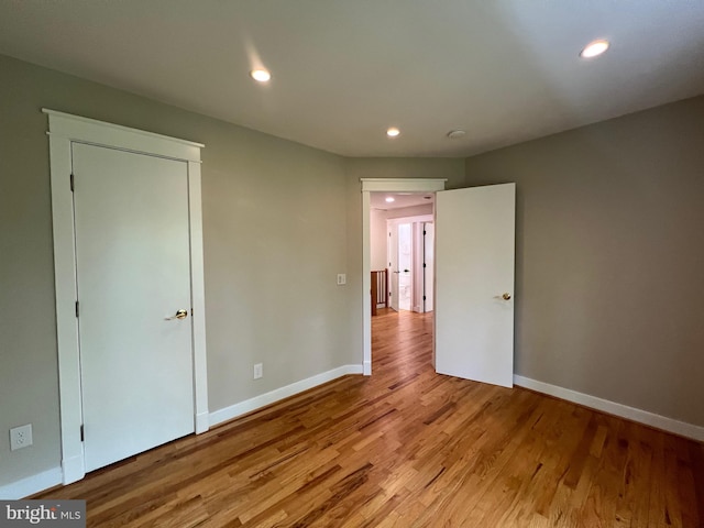 8122 Stacey Rd, Alexandria, VA 22308 - unfurnished bedroom with wood finished floors, baseboards, and recessed lighting