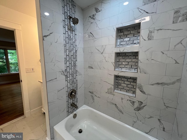 8122 Stacey Rd, Alexandria, VA 22308 - bathroom featuring bathing tub / shower combination, baseboards, and marble finish floor