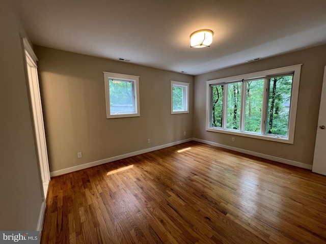 8122 Stacey Rd, Alexandria, VA 22308 - spare room with baseboards, visible vents, and wood finished floors