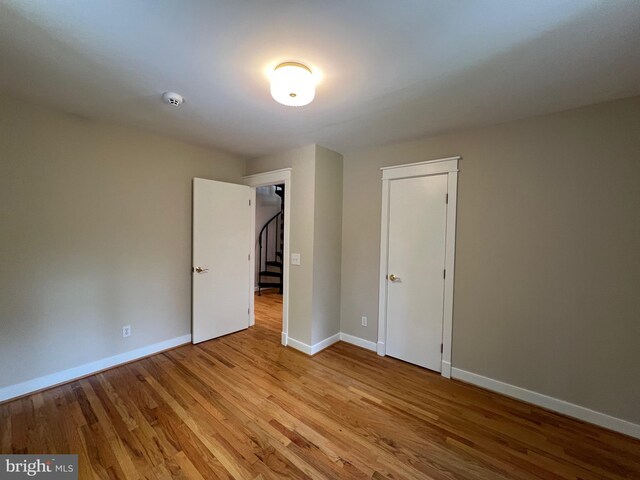 8122 Stacey Rd, Alexandria, VA 22308 - unfurnished bedroom with baseboards and wood finished floors