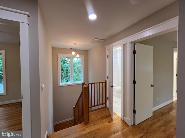 8122 Stacey Rd, Alexandria, VA 22308 - hall featuring wood finished floors, an upstairs landing, and baseboards