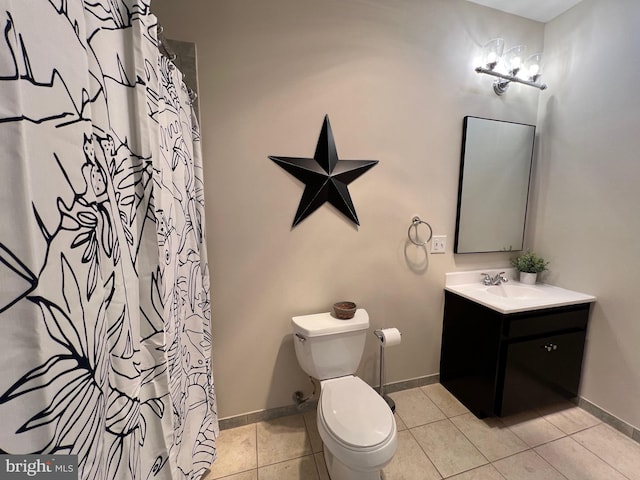 8122 Stacey Rd, Alexandria, VA 22308 - full bath featuring vanity, toilet, baseboards, and tile patterned flooring