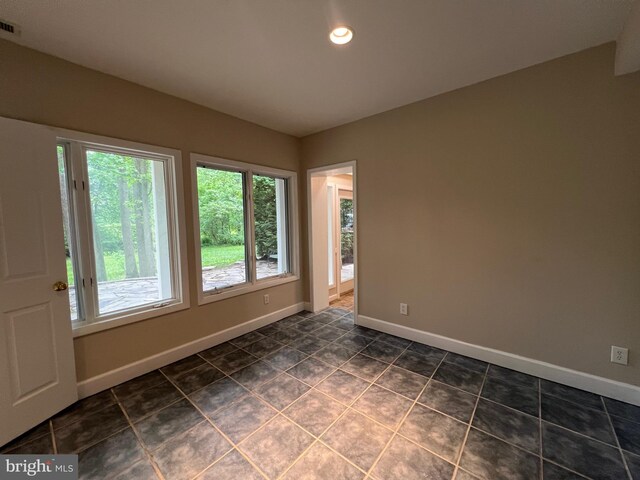8122 Stacey Rd, Alexandria, VA 22308 - spare room with dark tile patterned flooring, baseboards, and recessed lighting
