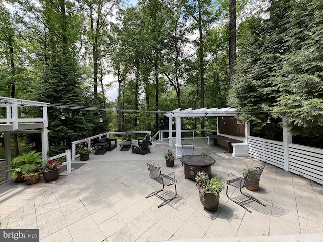 8122 Stacey Rd, Alexandria, VA 22308 - view of patio / terrace featuring an outdoor living space with a fire pit and a pergola