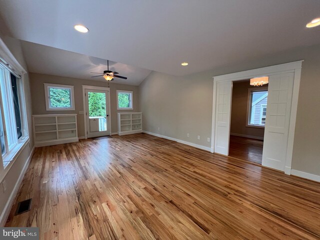 8122 Stacey Rd, Alexandria, VA 22308 - unfurnished living room with baseboards, a wealth of natural light, visible vents, and wood finished floors