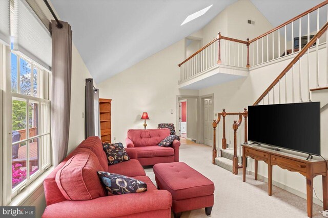 3161 Grande Oak Pl, Lancaster, PA 17601 - carpeted living room featuring stairway, a skylight, high vaulted ceiling, and visible vents