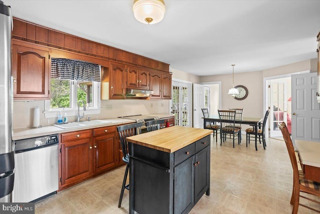 3161 Grande Oak Pl, Lancaster, PA 17601 - kitchen with a sink, decorative light fixtures, stainless steel dishwasher, butcher block countertops, and under cabinet range hood