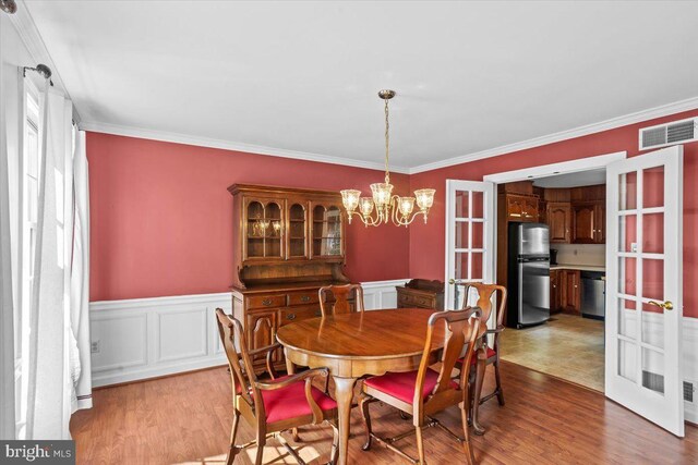 3161 Grande Oak Pl, Lancaster, PA 17601 - dining area featuring crown molding, french doors, visible vents, and wood finished floors