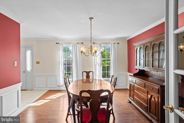 3161 Grande Oak Pl, Lancaster, PA 17601 - dining space with an inviting chandelier, a decorative wall, wainscoting, and ornamental molding