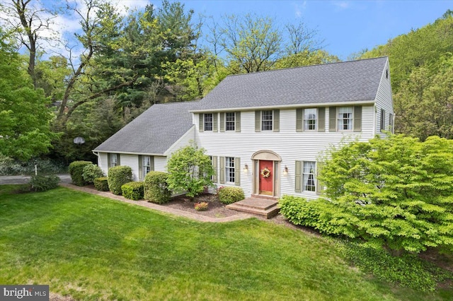 3161 Grande Oak Pl, Lancaster, PA 17601 - colonial-style house featuring a shingled roof and a front lawn