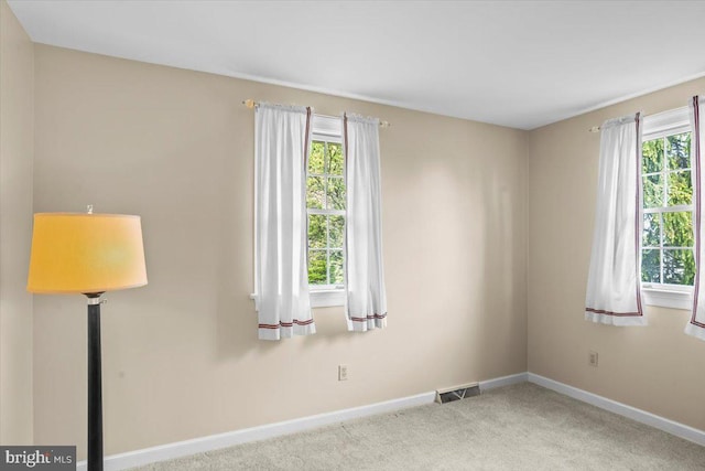 3161 Grande Oak Pl, Lancaster, PA 17601 - carpeted spare room with baseboards, a healthy amount of sunlight, and visible vents