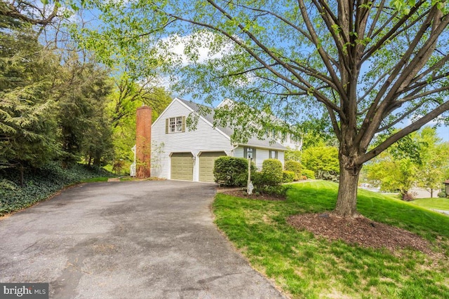 3161 Grande Oak Pl, Lancaster, PA 17601 - exterior space featuring aphalt driveway, a chimney, and a lawn