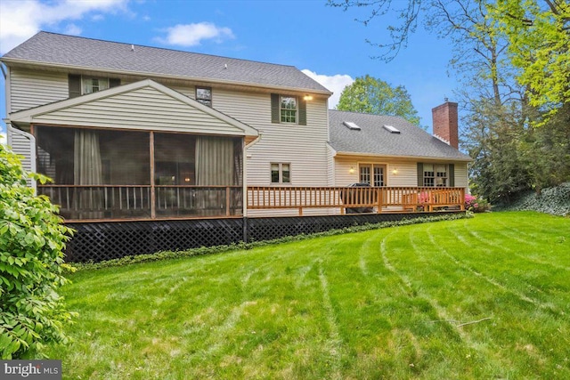 3161 Grande Oak Pl, Lancaster, PA 17601 - rear view of property with a sunroom, a wooden deck, a chimney, and a lawn