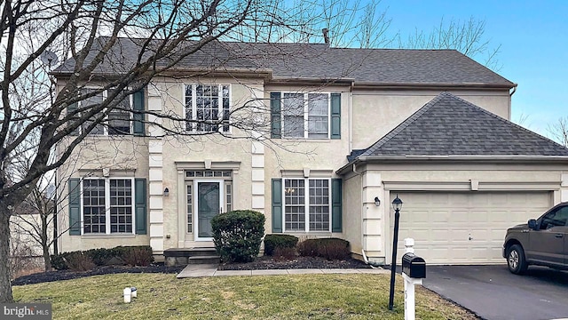 51 Knickerbocker Ln, Malvern, PA 19355 - view of front of home with roof with shingles, stucco siding, driveway, a front lawn, and a garage