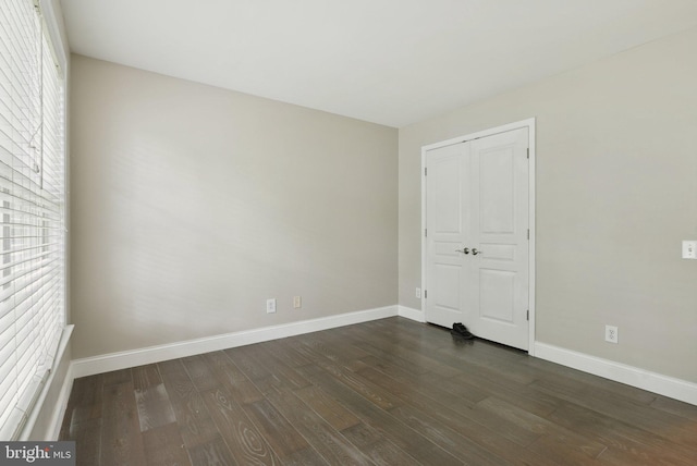 51 Knickerbocker Ln, Malvern, PA 19355 - unfurnished bedroom featuring baseboards, dark wood-type flooring, and a closet
