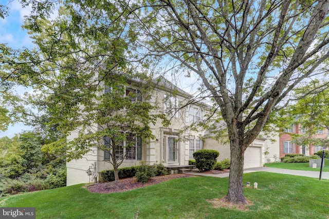 51 Knickerbocker Ln, Malvern, PA 19355 - view of property hidden behind natural elements featuring driveway, a front lawn, and an attached garage
