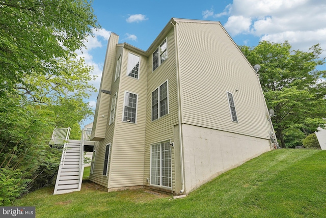 51 Knickerbocker Ln, Malvern, PA 19355 - back of property with stairs, a chimney, a lawn, and a wooden deck