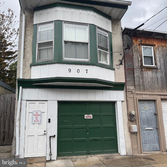 907 Birch St, Reading, PA 19604 - view of front of house with fence and an attached garage