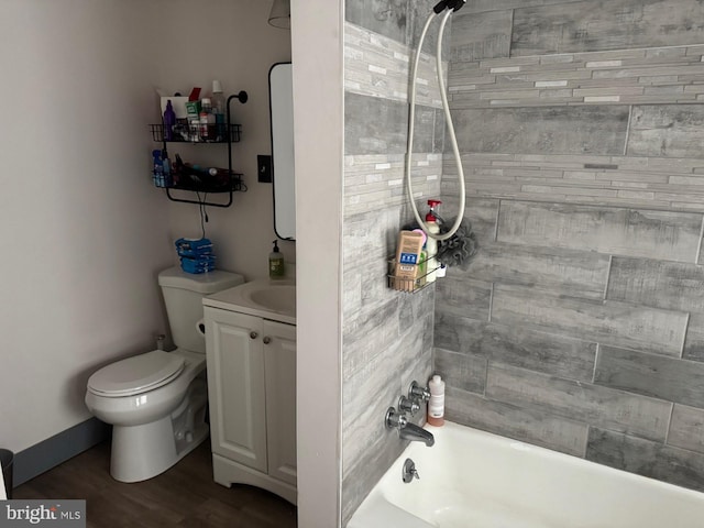907 Birch St, Reading, PA 19604 - full bathroom featuring toilet, vanity, wood finished floors, and bathing tub / shower combination
