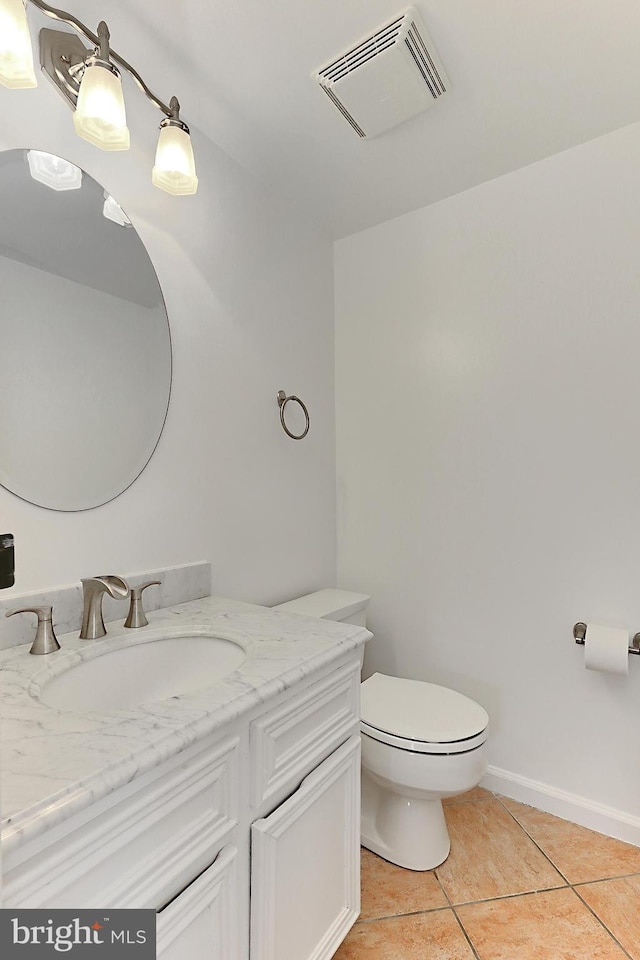 half bath featuring vanity, tile patterned flooring, toilet, and visible vents