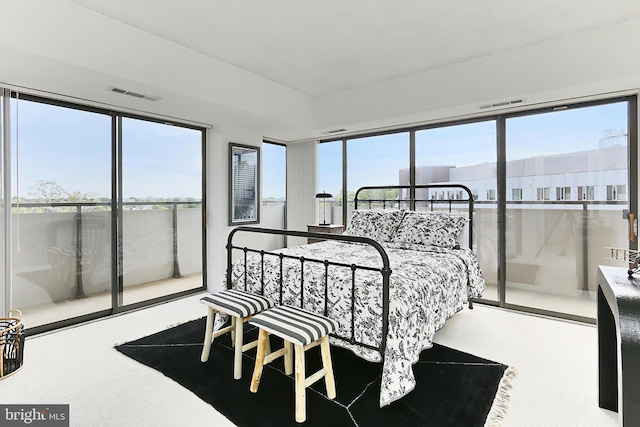 bedroom with carpet flooring and visible vents