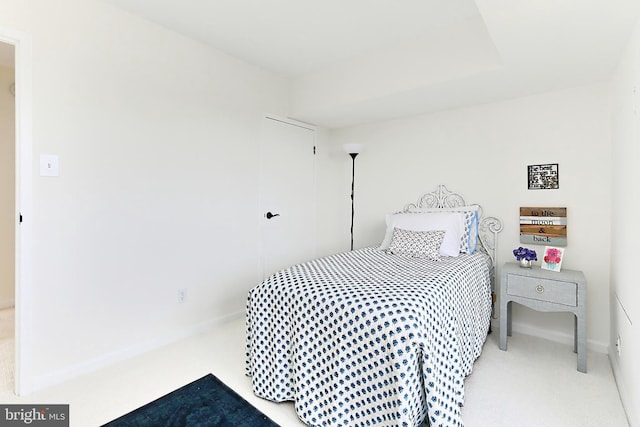 bedroom featuring carpet flooring and baseboards