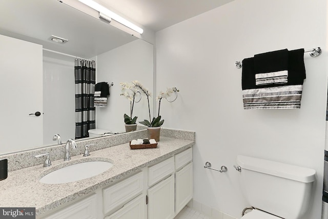 full bathroom with toilet, curtained shower, tile patterned flooring, and vanity