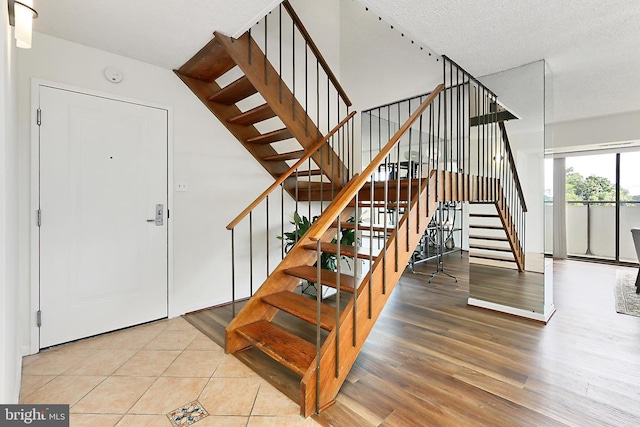 stairway featuring wood finished floors