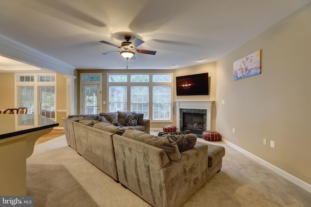 9124 Back Drop Dr, Perry Hall, MD 21128 - living area with ceiling fan, a high end fireplace, light colored carpet, baseboards, and crown molding