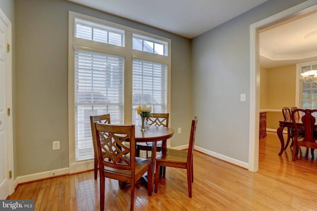 9124 Back Drop Dr, Perry Hall, MD 21128 - dining area with light wood finished floors, baseboards, and a chandelier
