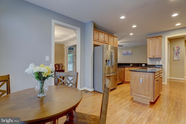 9124 Back Drop Dr, Perry Hall, MD 21128 - kitchen with stainless steel refrigerator with ice dispenser, light brown cabinetry, recessed lighting, a center island, and dark countertops