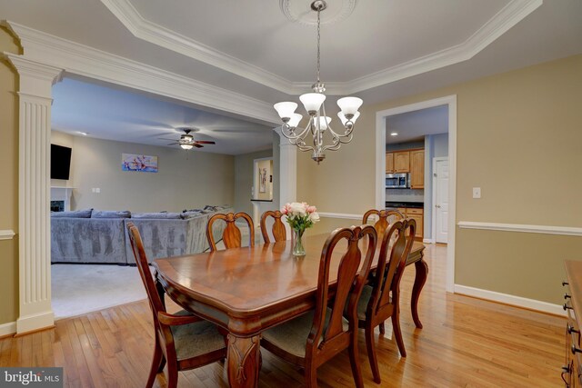 9124 Back Drop Dr, Perry Hall, MD 21128 - dining room with light wood finished floors, a ceiling fan, baseboards, a chandelier, and ornamental molding