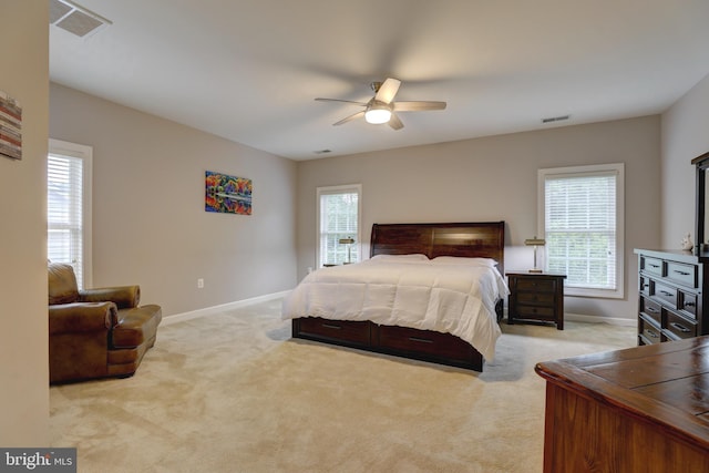 9124 Back Drop Dr, Perry Hall, MD 21128 - bedroom with multiple windows, light colored carpet, baseboards, and ceiling fan