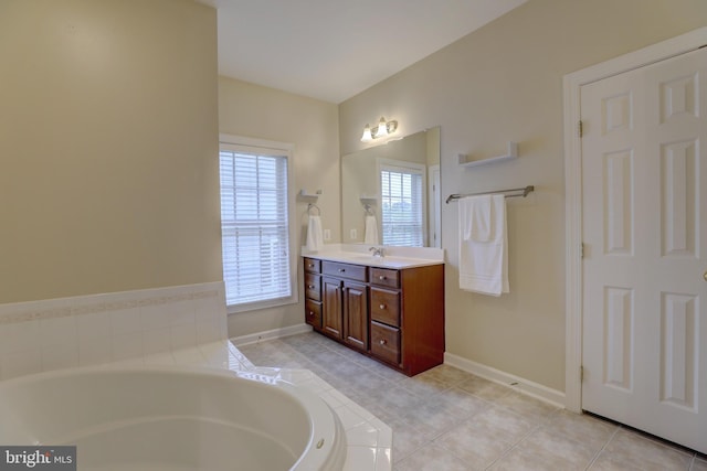 9124 Back Drop Dr, Perry Hall, MD 21128 - full bath with vanity, a bath, baseboards, and tile patterned flooring