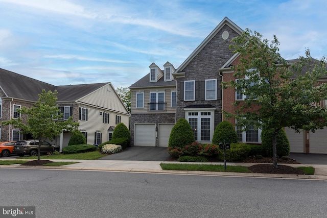 9124 Back Drop Dr, Perry Hall, MD 21128 - view of front of house with stone siding, driveway, and a garage