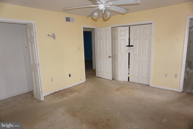 unfurnished bedroom featuring visible vents, carpet flooring, baseboards, and ensuite bathroom